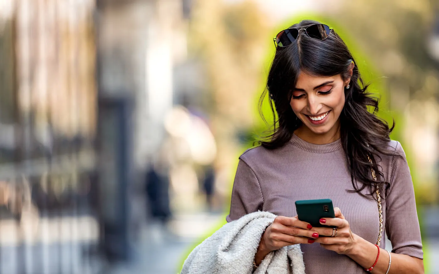 woman on phone looking at online banking