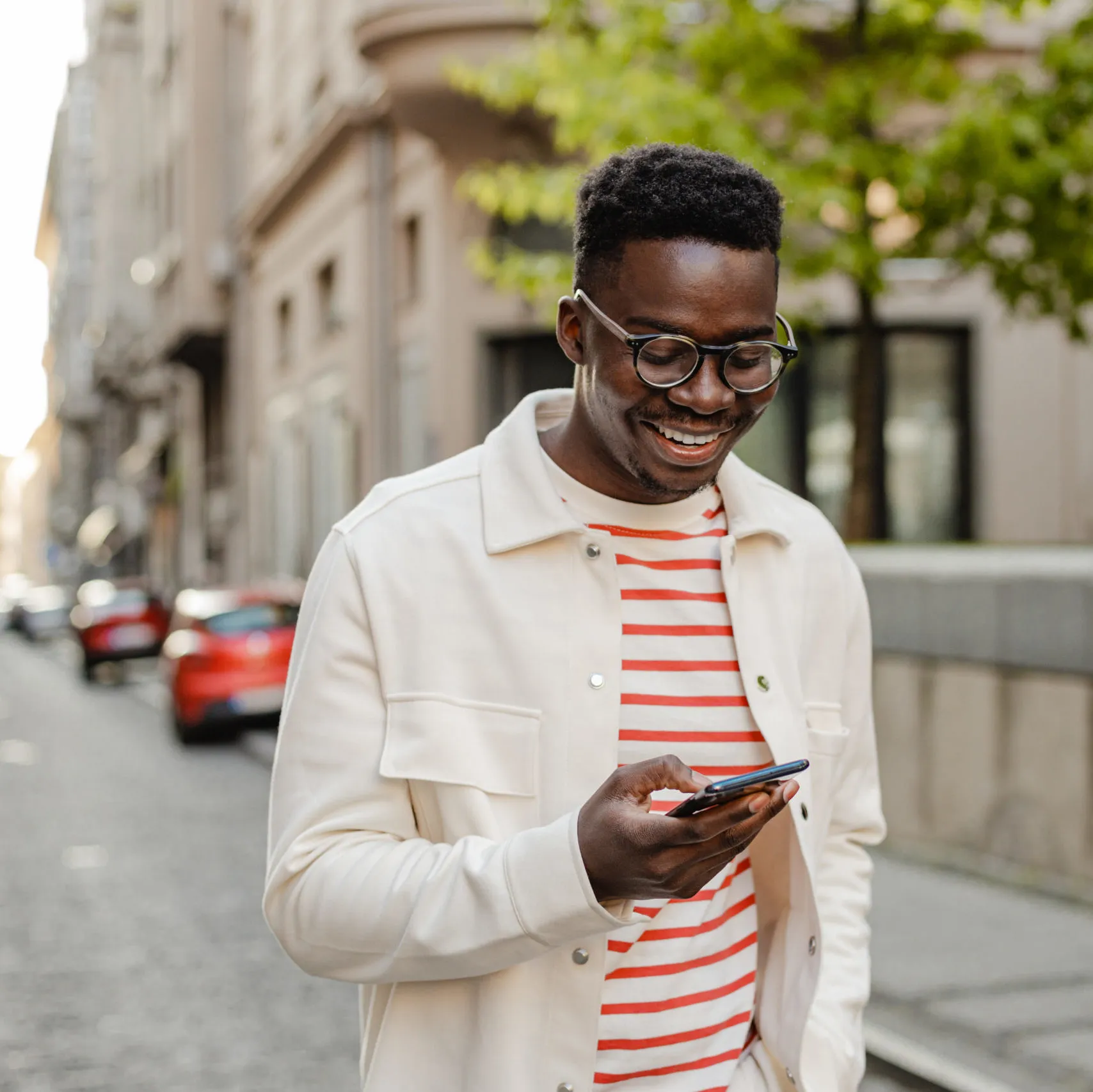 man walking using his phone to complete a banking transaction