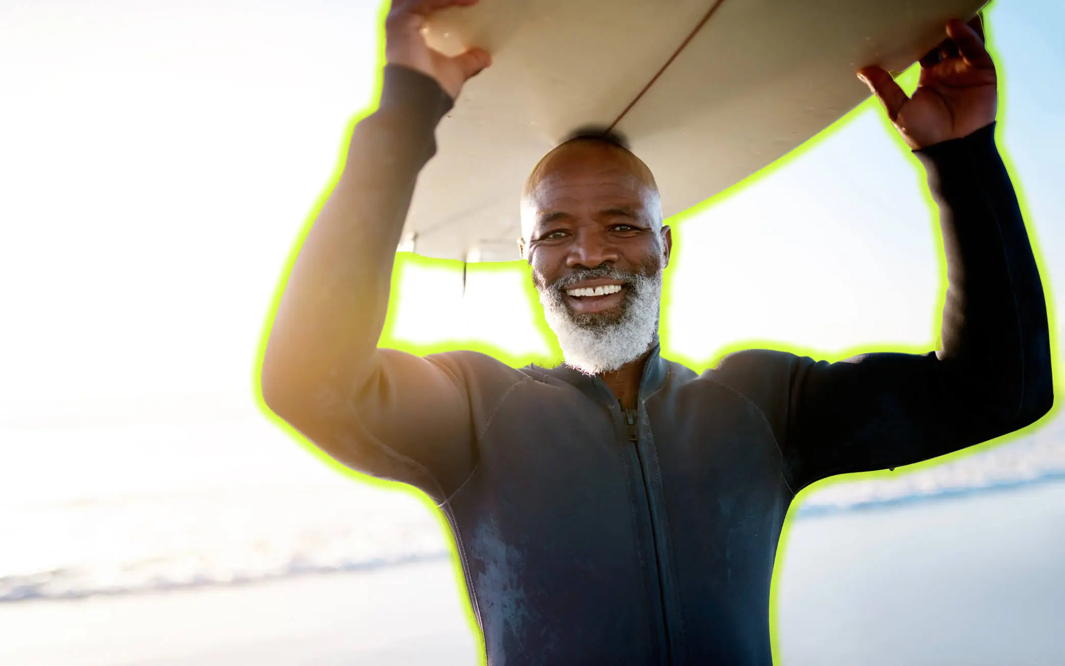 man with surfboard over his head