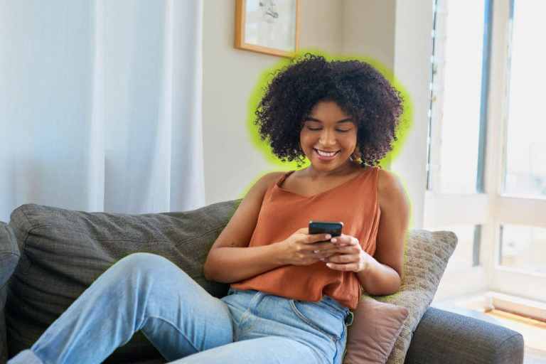 Woman on cell phone in living room