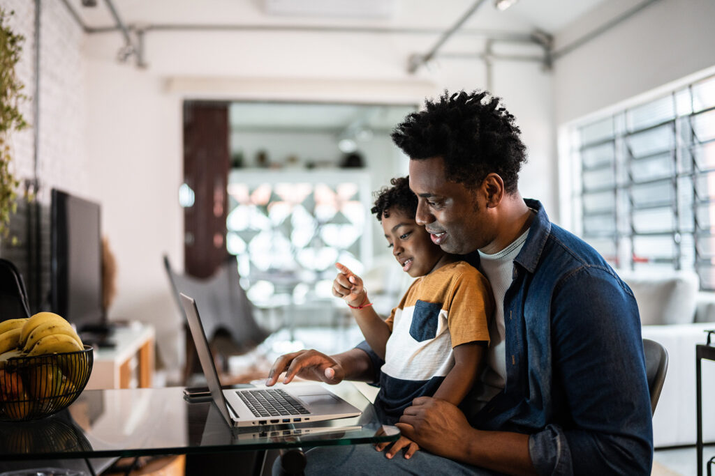 Father and son on computer